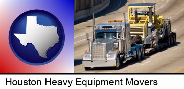 a semi-truck hauling heavy construction equipment in Houston, TX