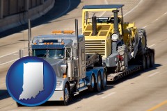 indiana map icon and a semi-truck hauling heavy construction equipment