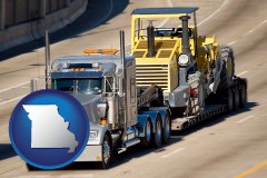 missouri map icon and a semi-truck hauling heavy construction equipment