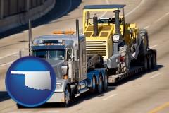 oklahoma map icon and a semi-truck hauling heavy construction equipment