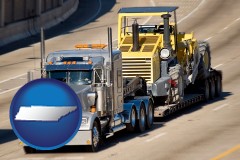 tennessee map icon and a semi-truck hauling heavy construction equipment