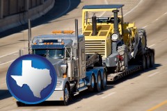 texas map icon and a semi-truck hauling heavy construction equipment