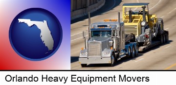 a semi-truck hauling heavy construction equipment in Orlando, FL